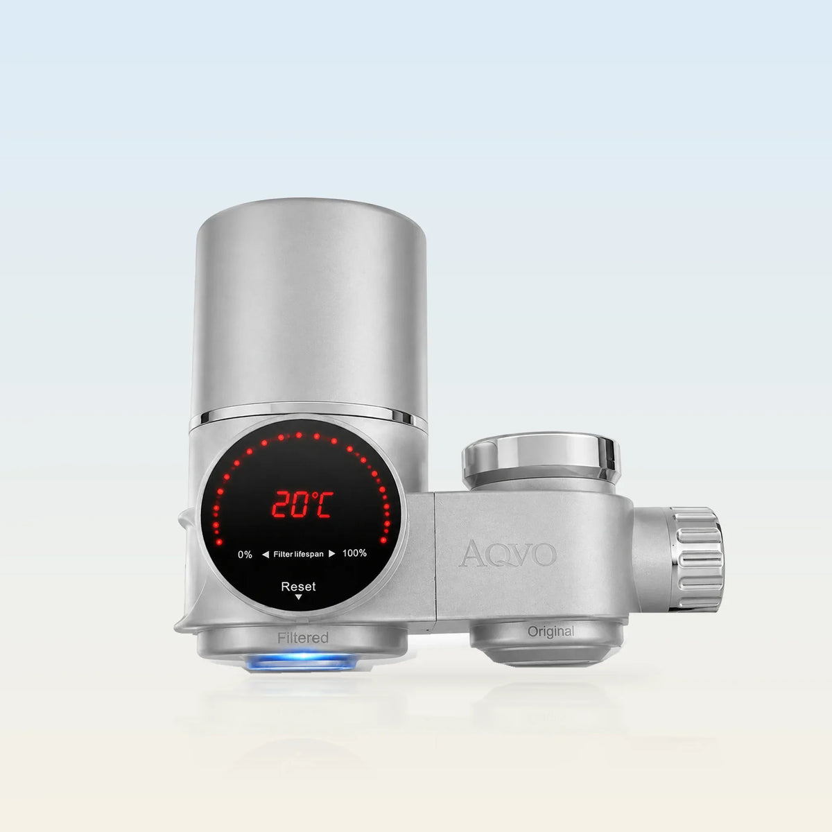 AQVO tap filter in brushed silver with filter-life and temperature display, Filtered and Original outlets (illustrative background)