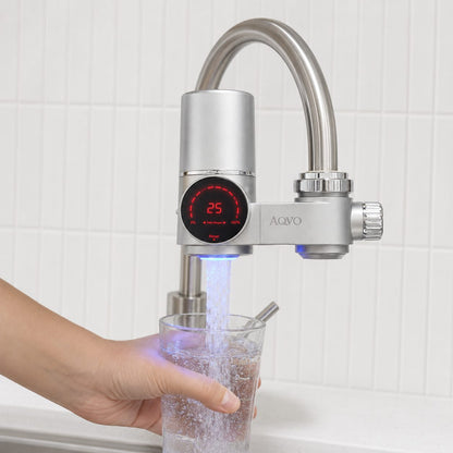 AQVO tap filter filling a glass, with the filter-life display lit while water flows