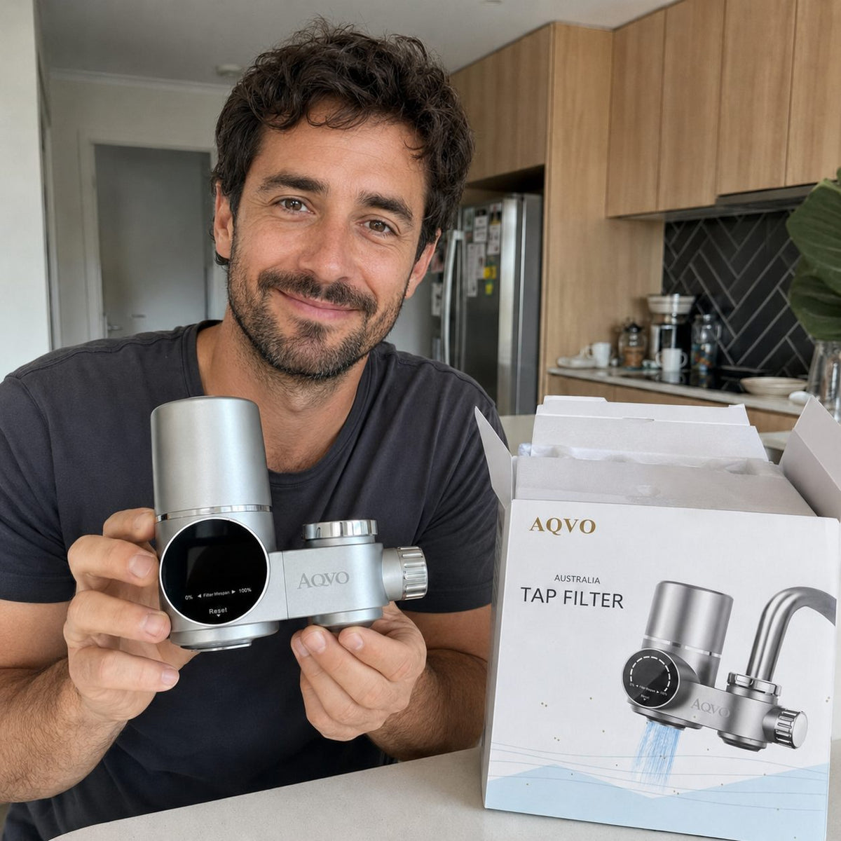 AQVO tap filter unboxed next to its retail box in a kitchen